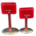 Two red Birdy Basketball hoop stands with stainless steel bases and hoops