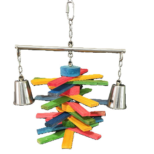 A colorful Stainless Steel bird safe toy with a rainbow of bird safe wooden pieces stacked in a tower, suspended from a silver metal bar with two bells on either side