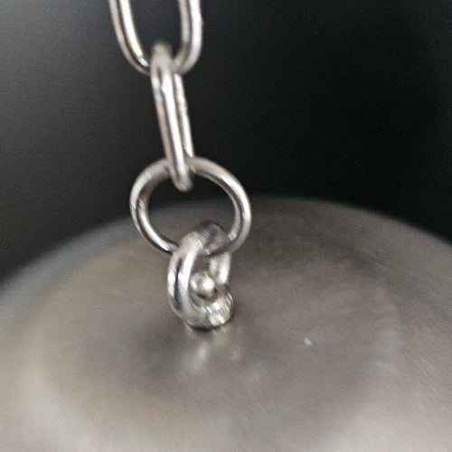 A close-up of the welded stainless steel top of the Dualing Jangles
