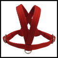 A red woven fabric bird harness with stainless steel D-rings and adjustment buckles